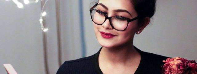 Eye doctor, woman wearing reading eyeglasses in Toronto, ON